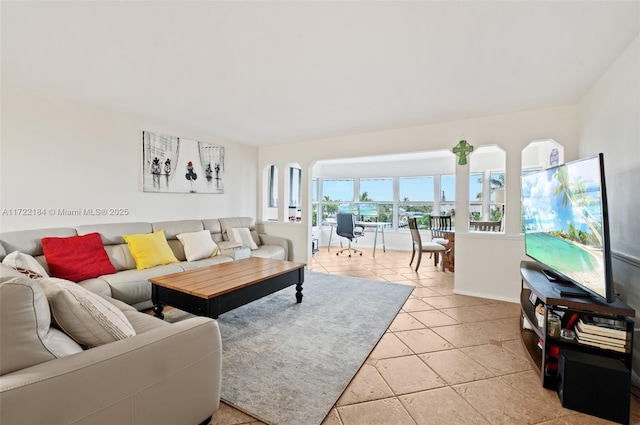 living room with light tile patterned flooring