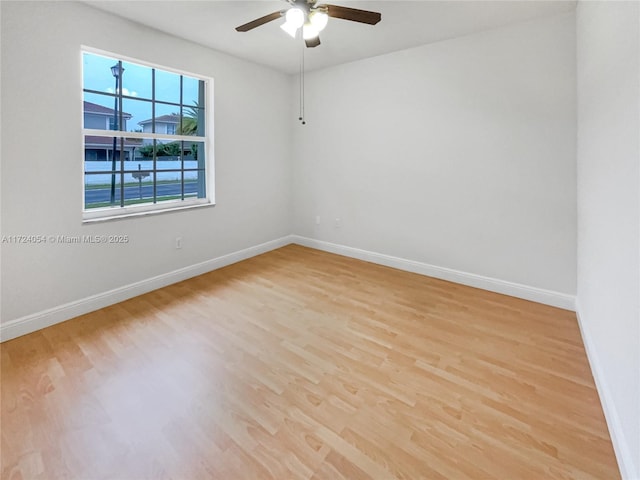 empty room with light hardwood / wood-style floors and ceiling fan