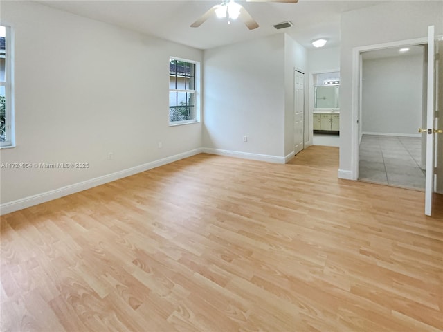 unfurnished room with ceiling fan and light hardwood / wood-style flooring