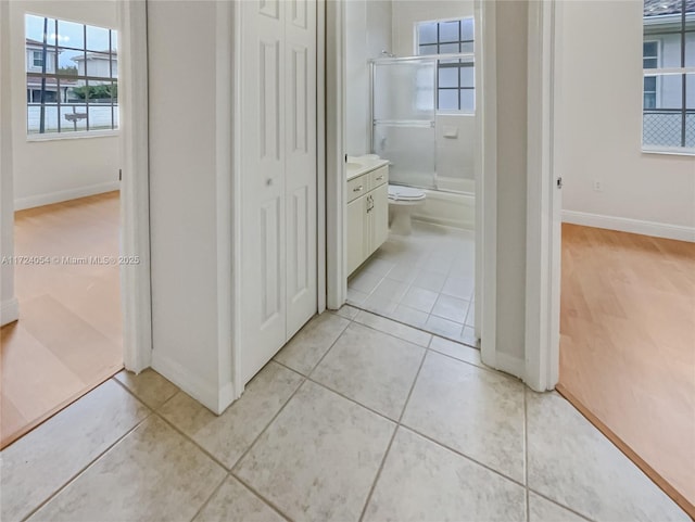 full bathroom featuring tile patterned floors, vanity, shower / bath combination, and toilet