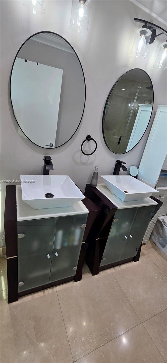 bathroom with vanity and tile patterned floors