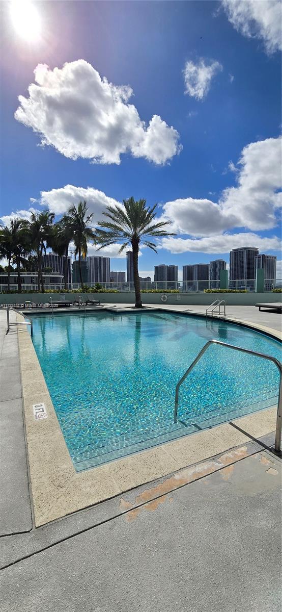 view of swimming pool with a patio area