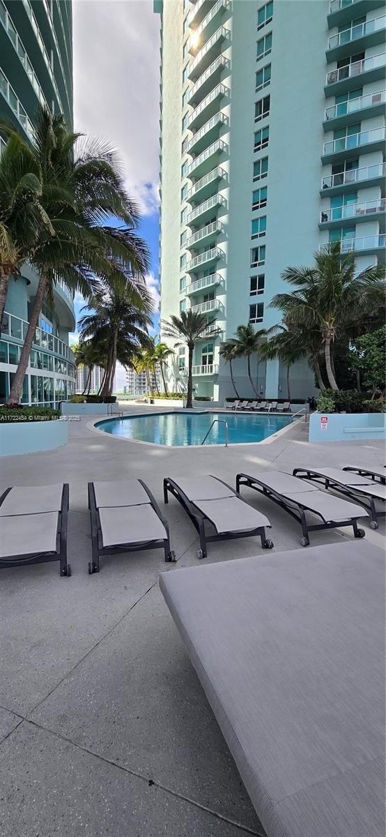 view of swimming pool with a patio area