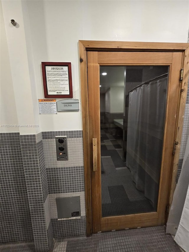 bathroom featuring tile walls and tile patterned floors