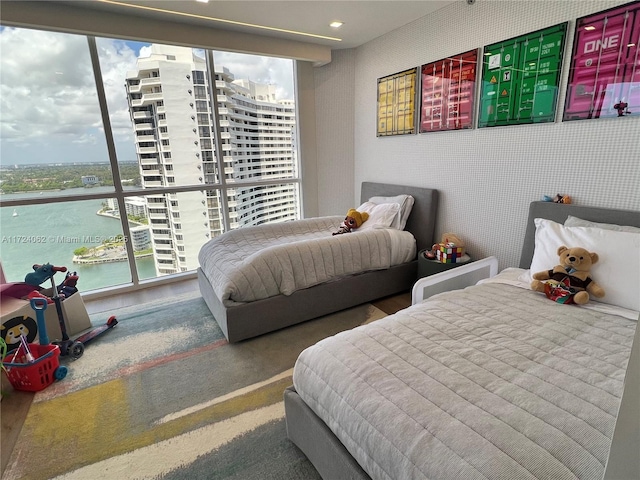 bedroom featuring a water view