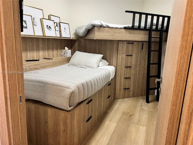 bedroom with light wood-type flooring