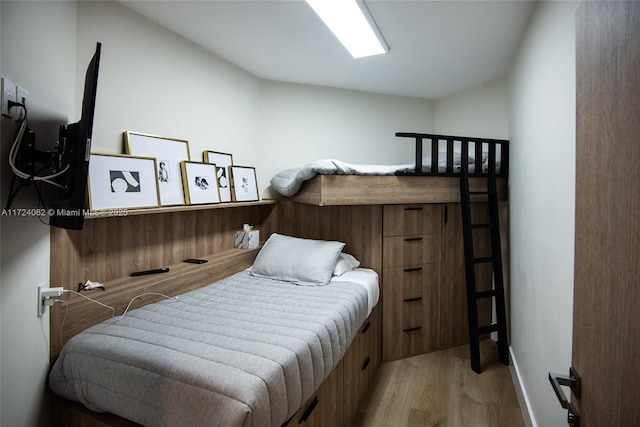 bedroom with light wood-type flooring