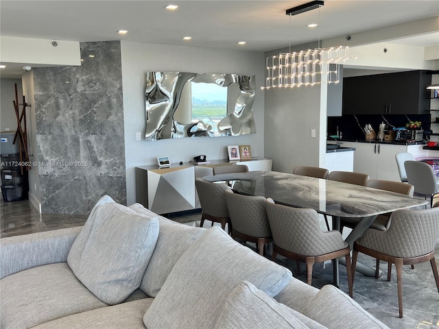 dining space with an inviting chandelier