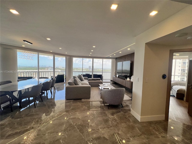 living room featuring a wall of windows