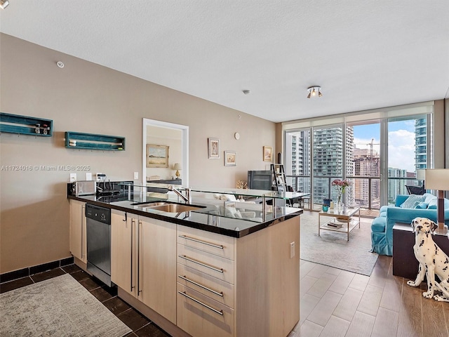 kitchen with dishwasher, expansive windows, sink, a textured ceiling, and kitchen peninsula