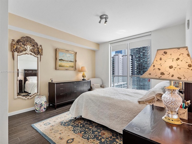 bedroom featuring dark hardwood / wood-style flooring