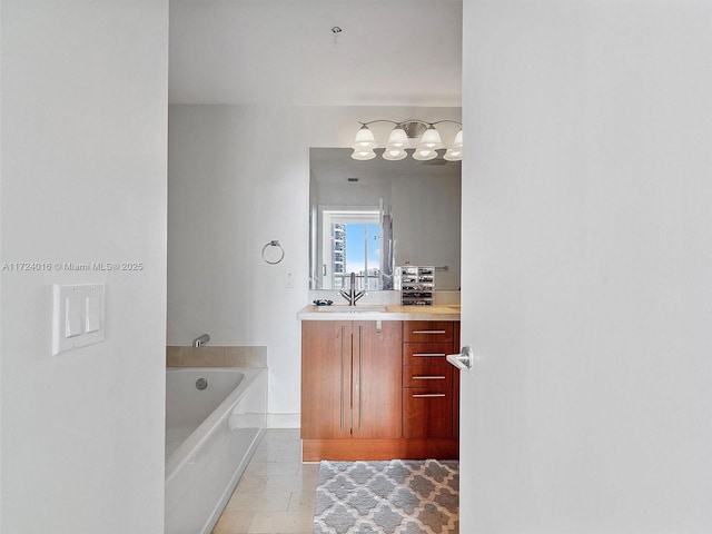 bathroom with vanity and a tub