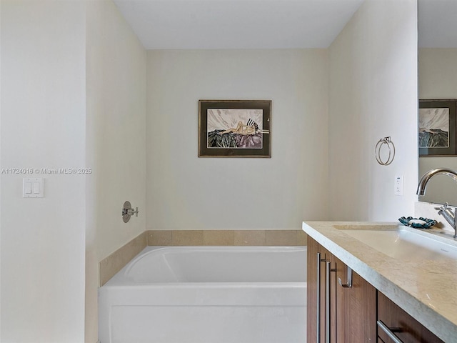 bathroom featuring a tub and vanity