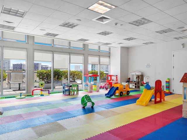 recreation room with a drop ceiling