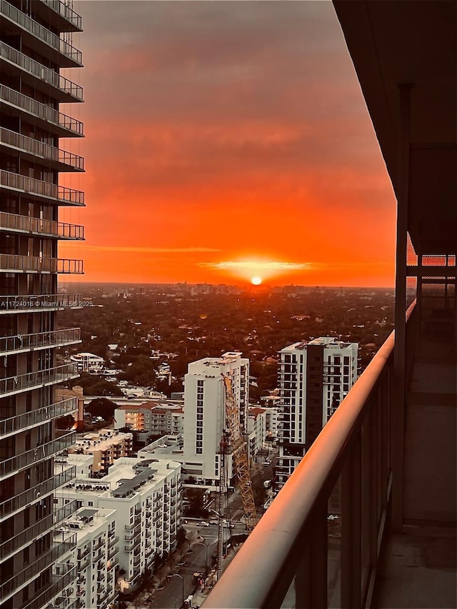 view of balcony at dusk