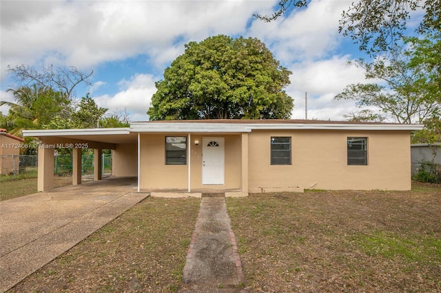 single story home with a carport