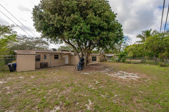 ranch-style home featuring a carport