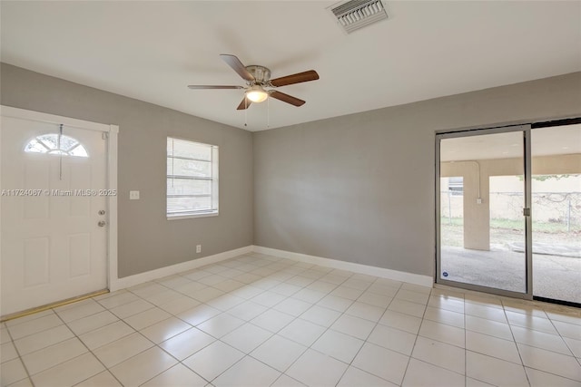 entrance foyer with light tile patterned flooring and ceiling fan