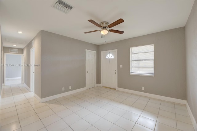 interior space featuring ceiling fan and light tile patterned floors