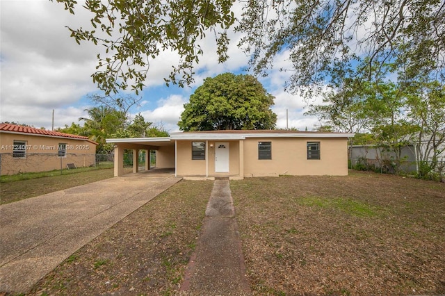 ranch-style home with a carport