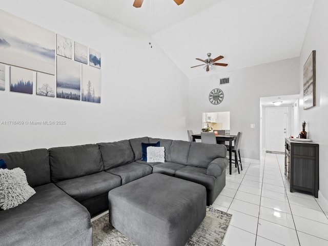 tiled living room featuring high vaulted ceiling and ceiling fan