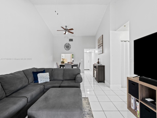 3868 N Carambola Cir N Unit 2961, Coconut Creek, FL 33066 - living area with ceiling fan, high vaulted ceiling, light tile patterned floors, and baseboards