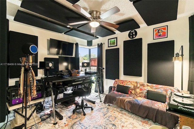 office area featuring ceiling fan and a textured ceiling