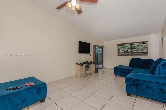 living room featuring light tile patterned floors, a textured ceiling, ceiling fan, and lofted ceiling