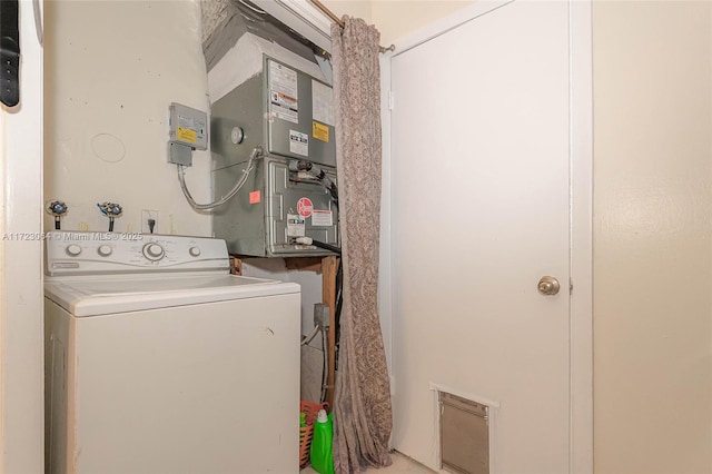 clothes washing area featuring washer / dryer