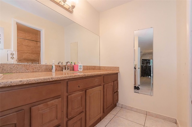 bathroom featuring tile patterned floors and vanity