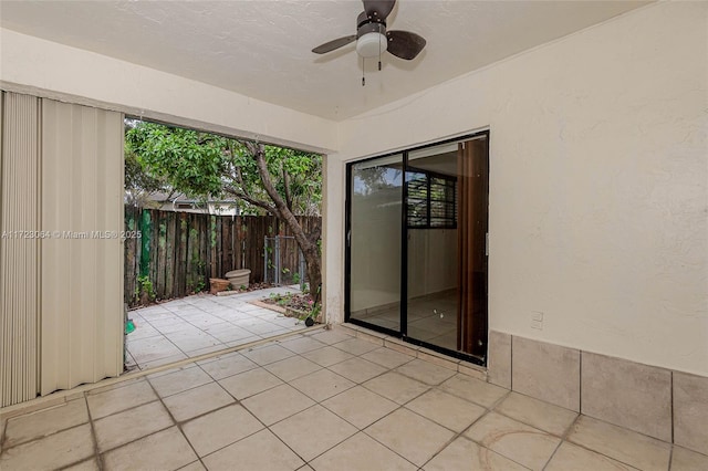 exterior space featuring ceiling fan