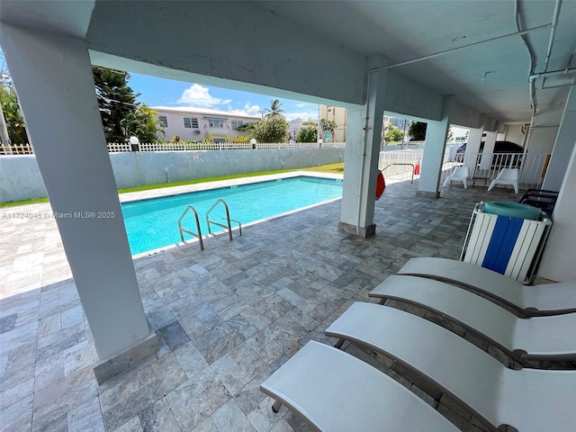 view of swimming pool featuring a patio area