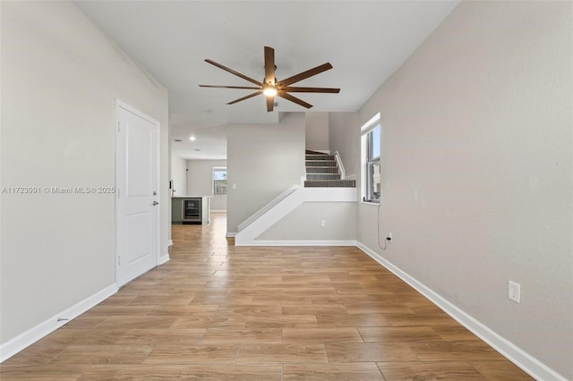 interior space featuring light hardwood / wood-style floors and ceiling fan