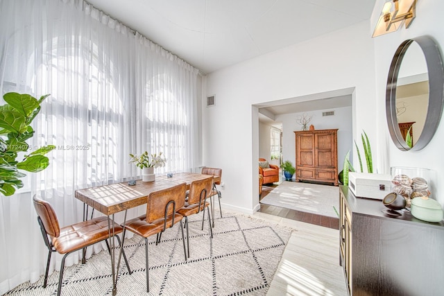 dining space with light wood-type flooring