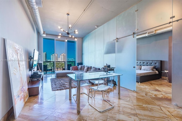 dining space featuring an inviting chandelier and a wall of windows