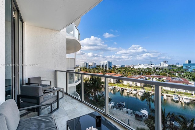 balcony featuring a water view