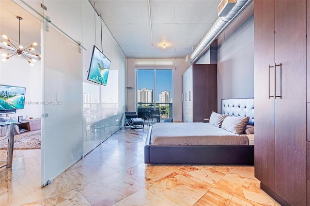 bedroom with a notable chandelier and floor to ceiling windows