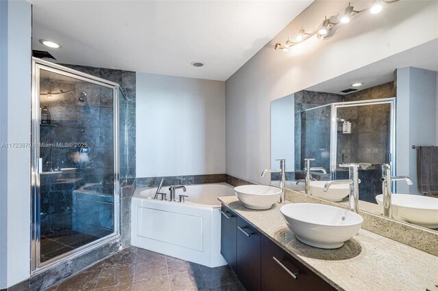 bathroom featuring vanity and plus walk in shower