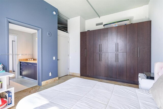 bedroom featuring ensuite bathroom