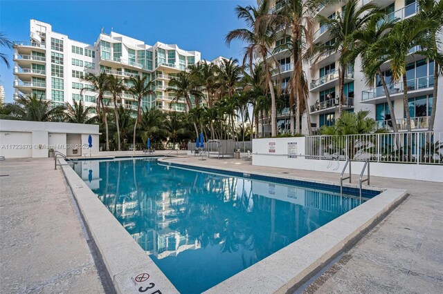 view of swimming pool with a patio area