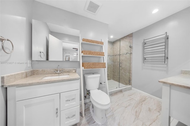 bathroom with radiator heating unit, vanity, an enclosed shower, and toilet