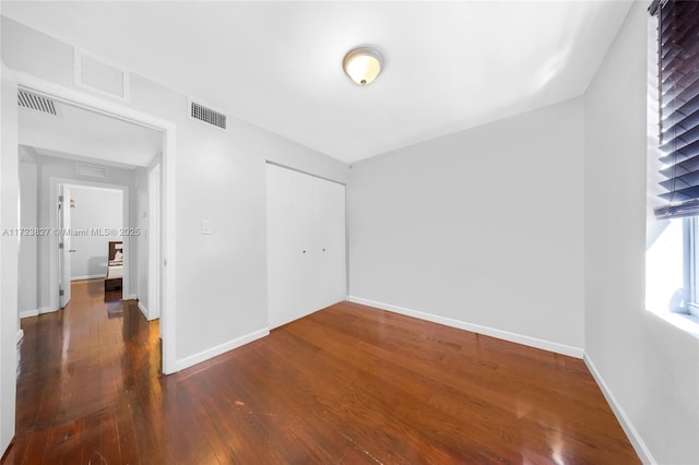 interior space with dark hardwood / wood-style floors