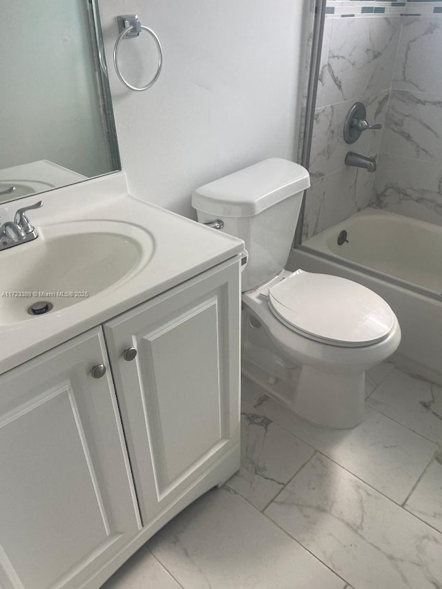 full bathroom with vanity, toilet, and tiled shower / bath combo