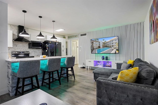 living room with light hardwood / wood-style floors