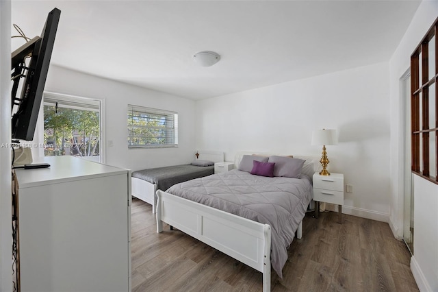 bedroom with hardwood / wood-style flooring