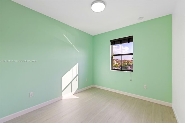 spare room featuring light hardwood / wood-style flooring