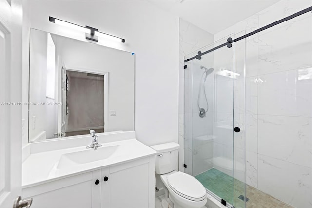 bathroom with vanity, toilet, and walk in shower