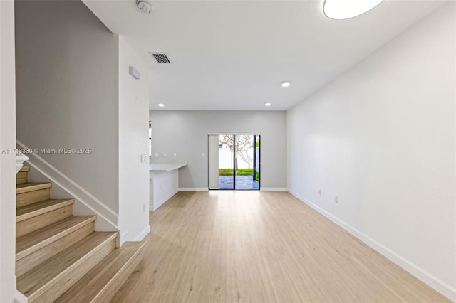 spare room featuring light wood-type flooring