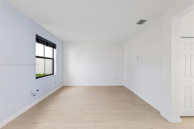 unfurnished room with light hardwood / wood-style floors