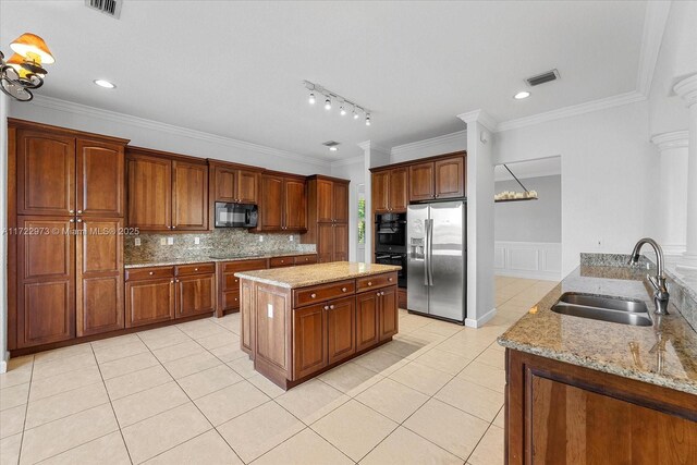 kitchen featuring crown molding, sink, black appliances, and light stone counters